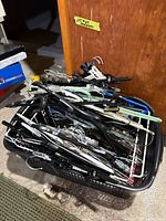 Basket filled with mixed plastic and wire hangers