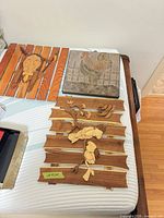 Overview of three wall hangings on table