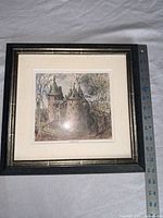 Full view showing framed print with ruler for scale