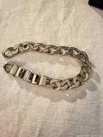 Full view of bracelet showing curb links and BILL letter segment