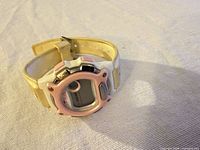 Front angled view of FILA digital sports watch showing bezel, screen and strap