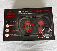 Front of RBX heated massage pillow box showing product image and key features
