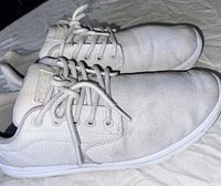 Side view of both shoes showing uppers, laces and overall condition