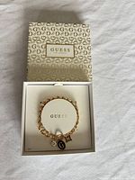 Bracelet inside open Guess box showing overall presentation