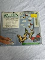 Front of sealed Wallies package showing branding and butterfly graphics