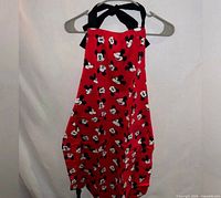 Full view of red Mickey Mouse apron hanging