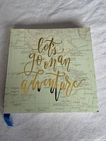 Front cover showing map design and gold foil text