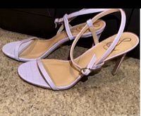 Side view of both sandals showing overall design and heel