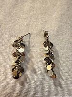 Front view of both earrings showing disc charm design