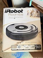 Front of box showing iRobot Roomba 560 model details