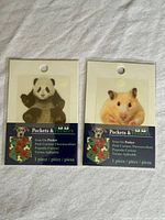 Front view of both sealed iron-on patches, panda and hamster designs