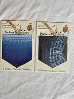 Front view of both sealed iron-on pockets showing colors and packaging.