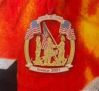 Front view showing detailed enamel design and ribbons