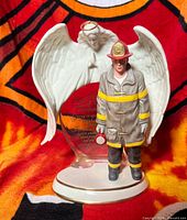 Front view showing firefighter, angel wings and inscription panel