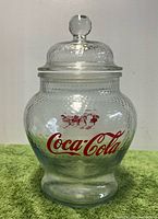 front view showing Coca-Cola logo and lid