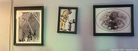 Overview showing all three framed prints on wall