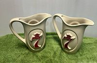 Front view of both ceramic Seagram's 7 pitchers showing logo and overall appearance