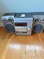 Front view of Aiwa CX-ND20G main unit with paired speakers