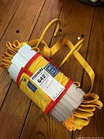 Folded escape ladder showing hooks, straps and label