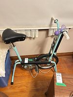 Full view of Firm Line exercise bike showing frame, seat and handlebars