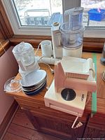 Group shot showing food processor, slicer, immersion blender, discs and juicer