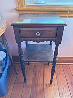 Full view of side table showing drawer, legs, shelf