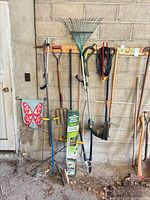 Overall view of all tools hanging on wall rack