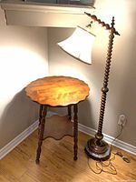 Floor lamp and matching wood table displayed together