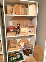 Wide view of shelving with various pine craft pieces