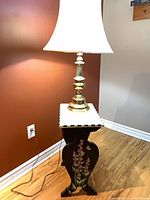 Lamp on side table showing lamp design and table top