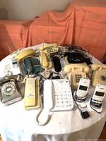 Entire collection of telephones on round table
