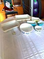 Group view of all dishes, bowls and toothpick holder on table