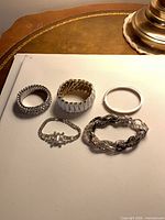 All five bracelets laid out on table