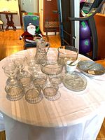 overall view of all crystal, glass, marble and pottery items on table