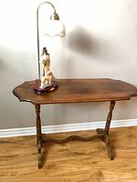 Full view of sofa table with lamp placed on top