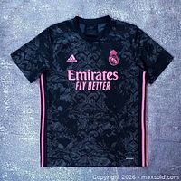 Front view of Adidas Real Madrid black/pink third jersey