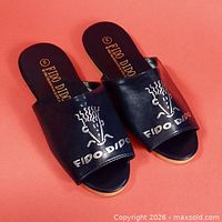 overall view of both shoes top side showing graphics