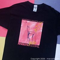 Full front view of T-shirt showing graphic and overall condition