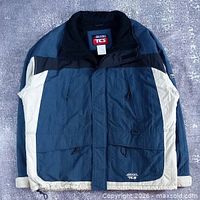 Front view of Brooks TCS jacket showing color scheme, pockets and branding