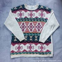 Front view of patterned sweater showing overall design and condition