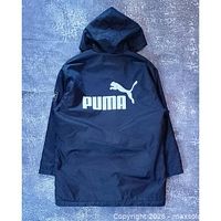 Back view of navy hooded jacket showing large white Puma logo