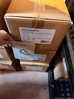 Factory boxes labeled Joulz Energy Co containing product