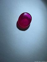 Top view of oval ruby showing color and polish