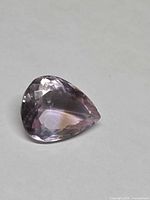 Pear-shaped faceted ametrine front view