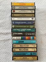 Stacked view of all 15 cassette spines showing artist and album titles