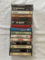 Spine view of all 15 cassettes stacked in rack