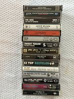 Stack of 15 cassette spines showing titles and catalogue numbers