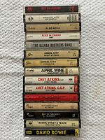 Stack of cassette spines showing artist and album names