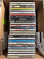 Stack of CD spines showing many album titles