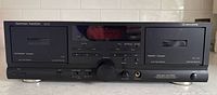 Front view of Harman Kardon DC520 dual cassette deck powered off